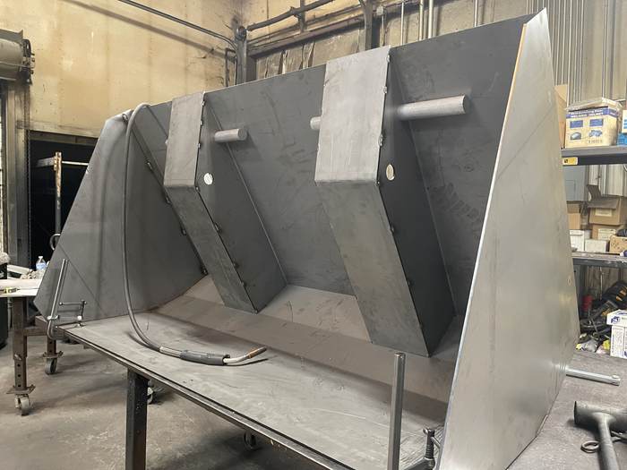 Welded chute assembly